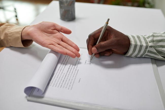 Client Singing Agreement in Bank
