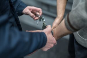 person getting handcuffs put on them